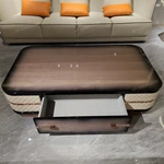 Storage Coffee Table with Quilted Leather Panels and High-Gloss Wood Veneer
